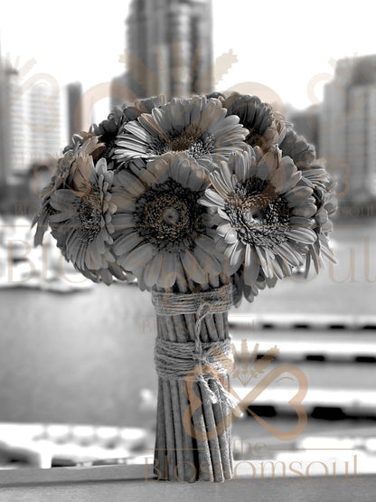 Black and white digital artwork of a mono bouquet with orange gerberas tied with rustic twine, handcrafted and photographed in Dubai Marina.